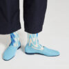 Ops&Ops No10 Action Light Blue leather flats close-up worn here with blue paisley socks and navy cropped trousers