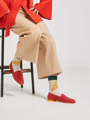 Ops&Ops No10 Action Red leather flats worn with colour-block socks, tan cropped trousers and tie-belt vibrant jacket