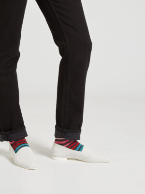 Ops&Ops No10 Action White leather flats worn with multi-striped lurex socks and black turned-up jeans