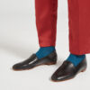 Ops&Ops No10 Classic Black leather flats close-up worn with rust-coloured slim-leg trousers and teal socks