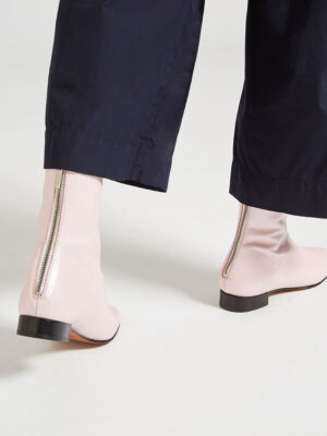 Ops&Ops No12 Pink Frost leather go-go boots, worn with cropped navy trousers close-up of zips