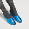 Ops&Ops No15 Turquoise leather wedge mules close-up worn with grey animal print tights
