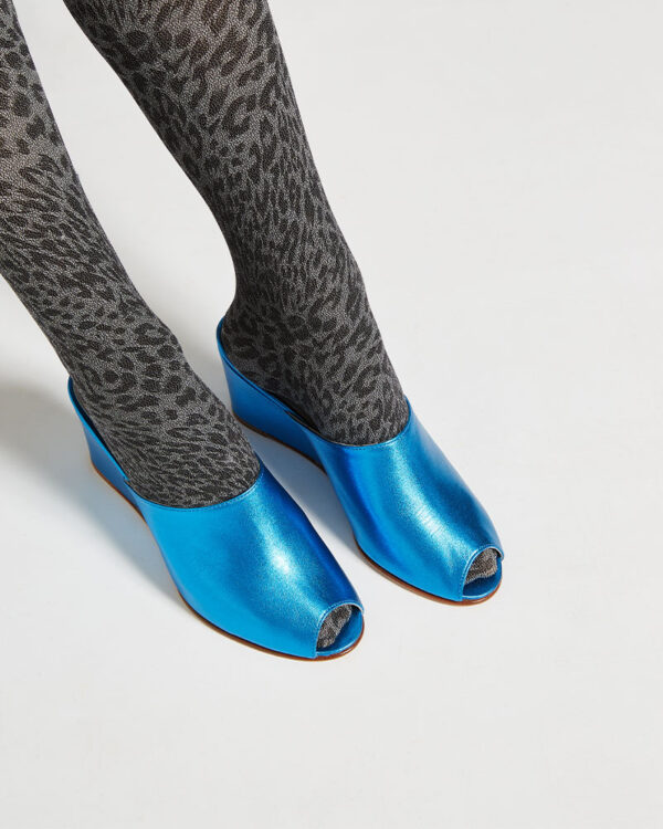 Ops&Ops No15 Turquoise leather wedge mules close-up worn with grey animal print tights