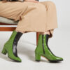 Ops&Ops No16 Avocado mid-heel leather boots close-up worn with cropped wide-leg tan trousers