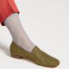 Ops&Ops No17 Olive nubuck flats close-up worn with grey fine socks and rust slim-leg trousers