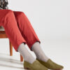 Ops&Ops No17 Olive nubuck flats worn with grey fine socks and rust slim-leg trousers
