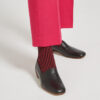 Ops&Ops No17 Classic Black leather flats worn with cropped pink trousers and striped socks