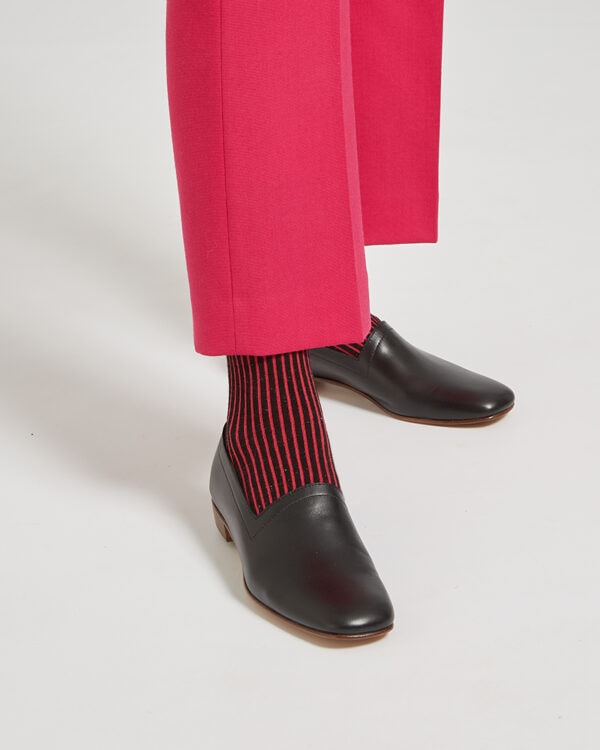 Ops&Ops No17 Classic Black leather flats worn with cropped pink trousers and striped socks