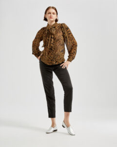 Marla in Ops&Ops No11 Sterling Silver block heels with cropped black trousers and Ganni animal print, pussy-bow blouse
