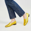 Marla in Ops&Ops No11 Yellow Gold block heels and jeans from the side