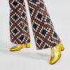 Ops&Ops No16 Gold Duo metallic leather boot worn with vintage patterned boot-cut trousers