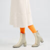 Ops&Ops No16 Modern Grey boot in grey and ivory smooth leather with ivory leather skirt and orange tights, side view