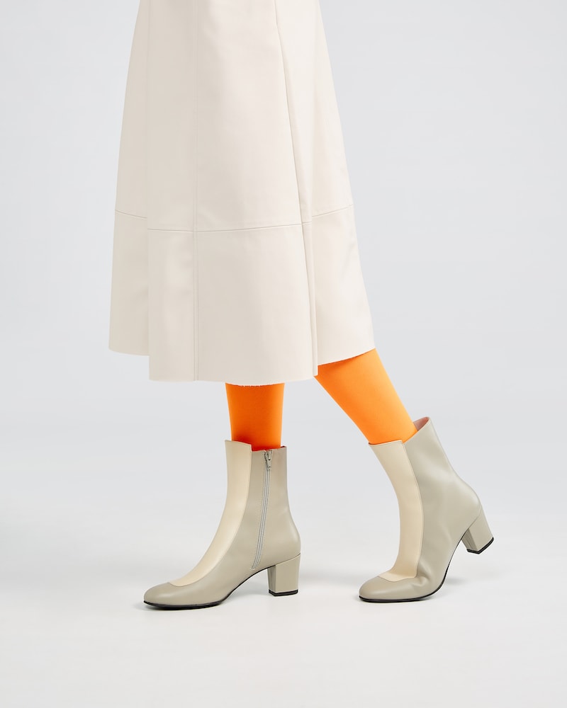 Ops&Ops No16 Modern Grey boot in grey and ivory smooth leather with ivory leather skirt and orange tights, side view
