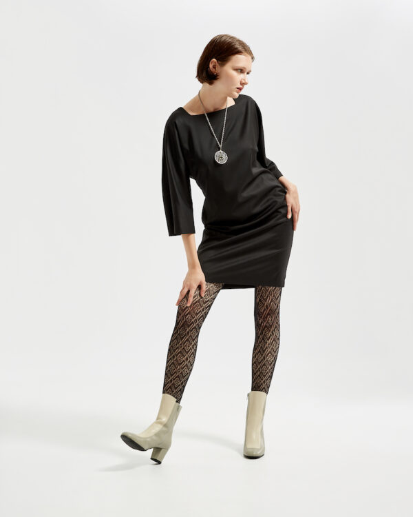 Marla wears Ops&Ops No16 Modern Grey boot with black dress and patterned tights