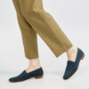 Marla in Ops&Ops No17 Petrol nubuck flats with fawn-coloured trousers from the side