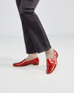 Ops&Ops No17 Ruby patent leather loafers worn with black satin trousers, left toe pointed