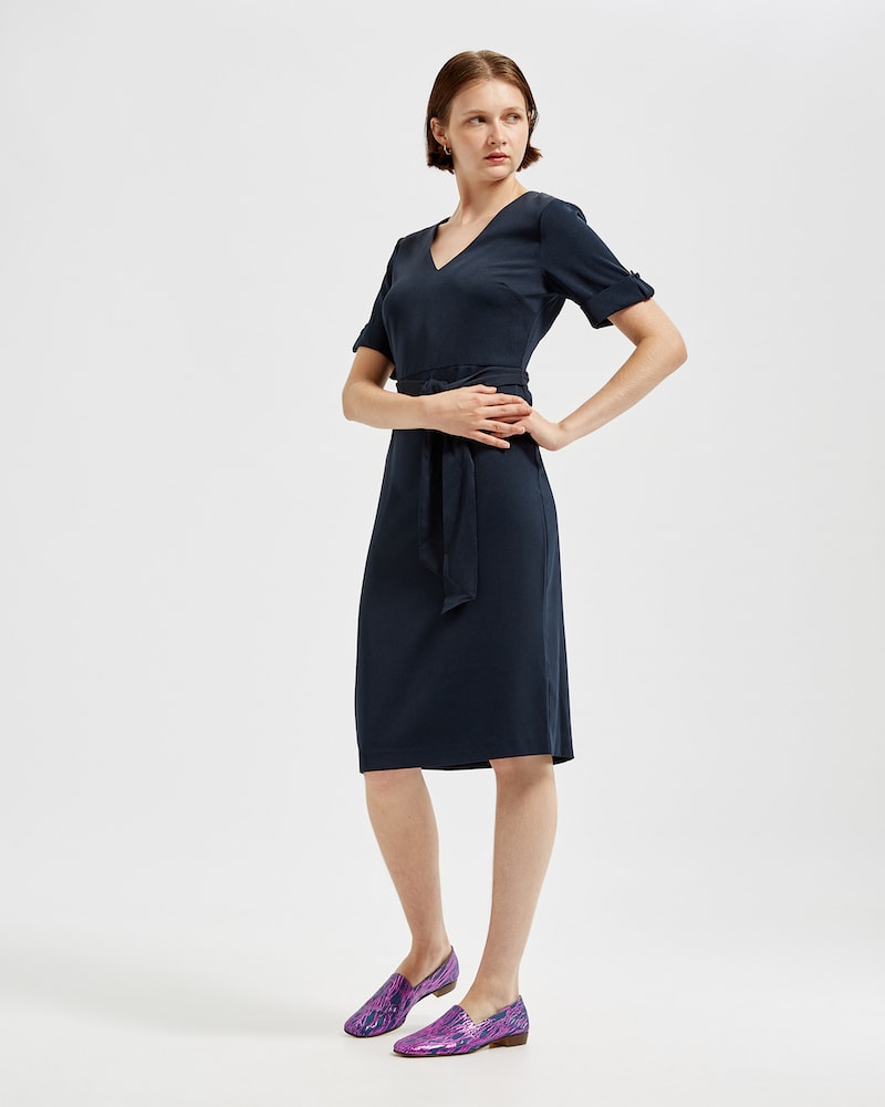 Marla in Ops&Ops No17 Woodland Blue flats with belted navy blue dress