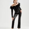 Marla wears Ops&Ops No10 Lurex White flats with black satin boot-cut trousers, vintage maribou feather top and silver belt