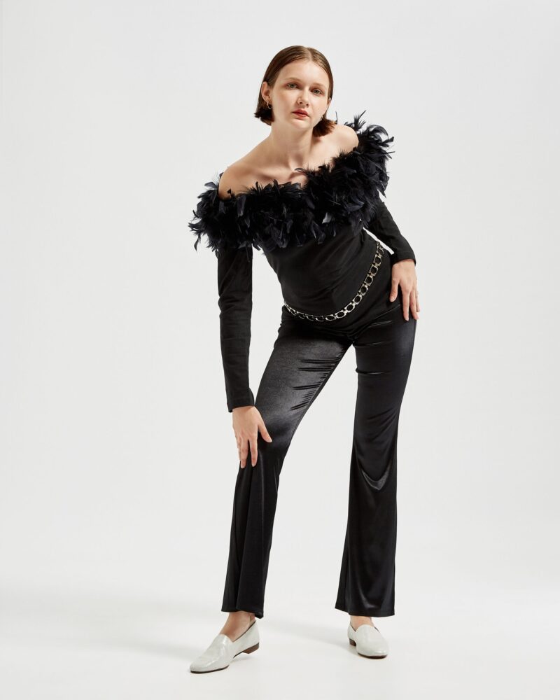 Marla wears Ops&Ops No10 Lurex White flats with black satin boot-cut trousers, vintage maribou feather top and silver belt