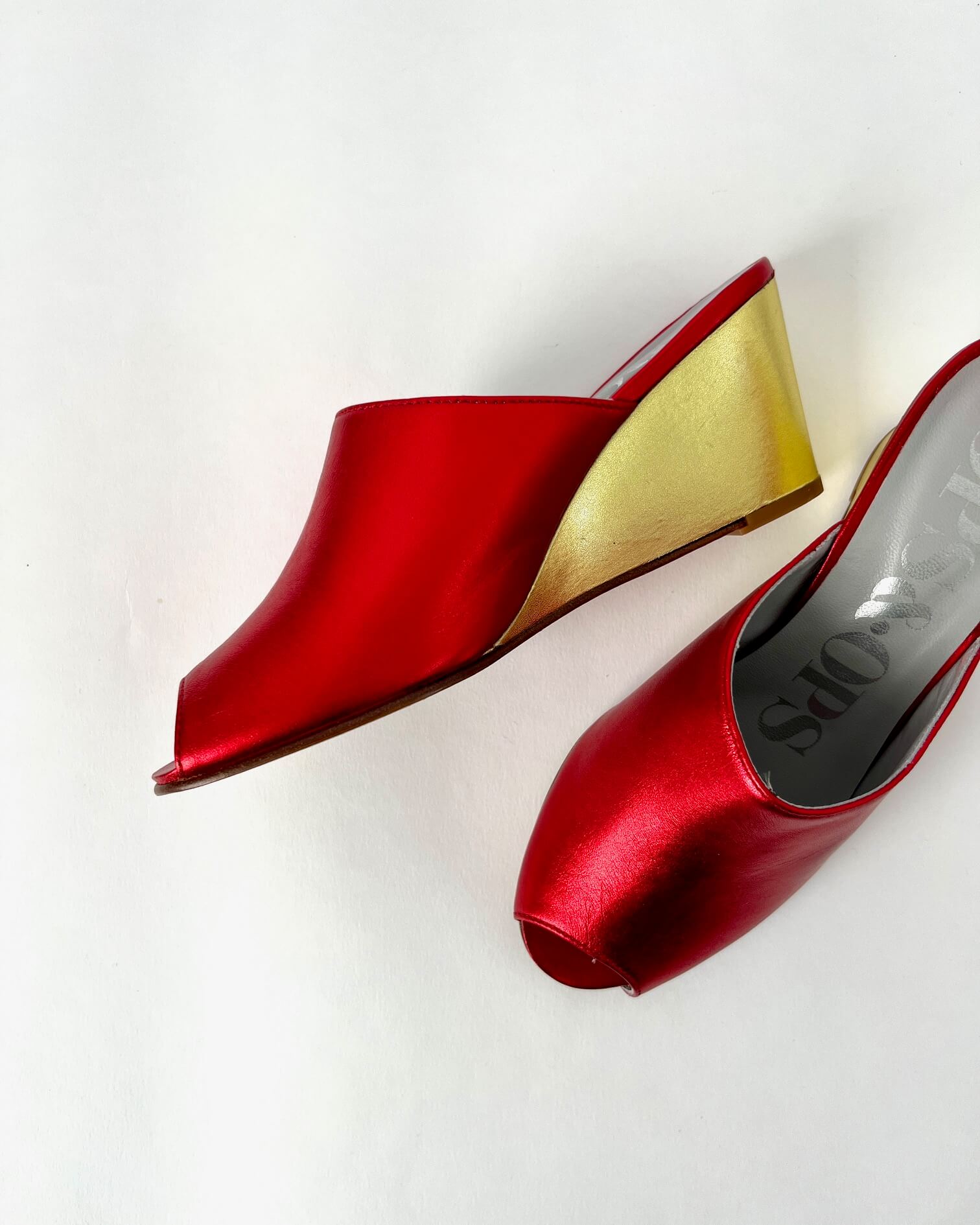 Ops&Ops No15 pair of red and gold metallic leather wedge mules one on side one from above in sample sale