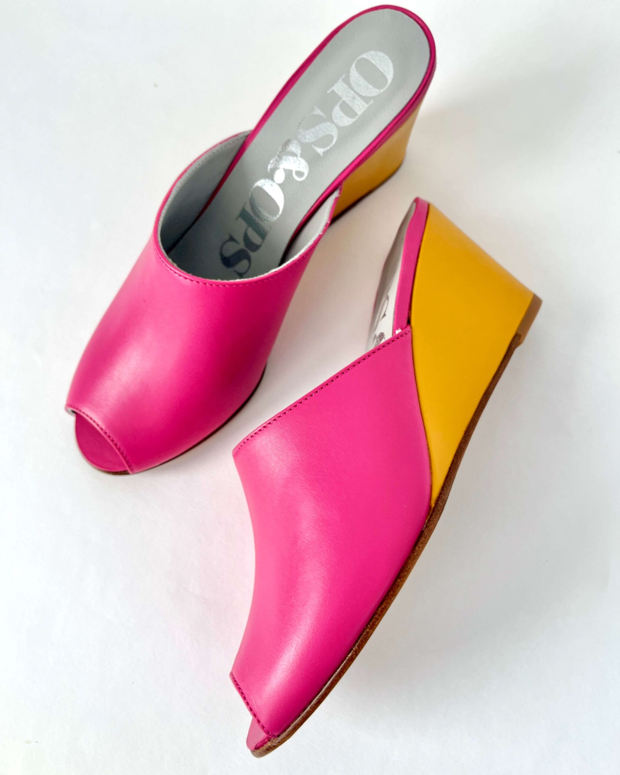 Ops&Ops No15 pair of pink and mustard leather wedge mules one on side one from above in sample sale