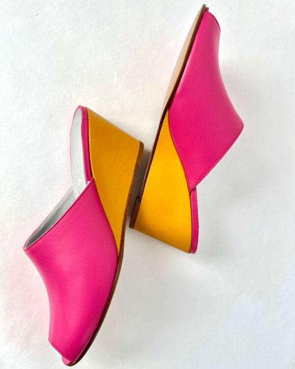 Ops&Ops No15 pair of pink and mustard leather wedge mules side view in sample sale