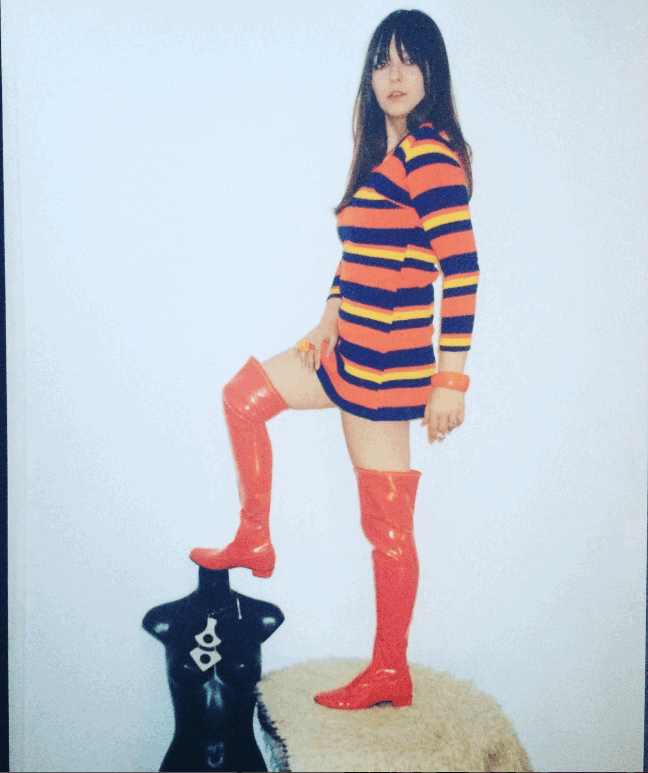 Mod Anja in vintage striped dress and over-the-knee vinyl boots